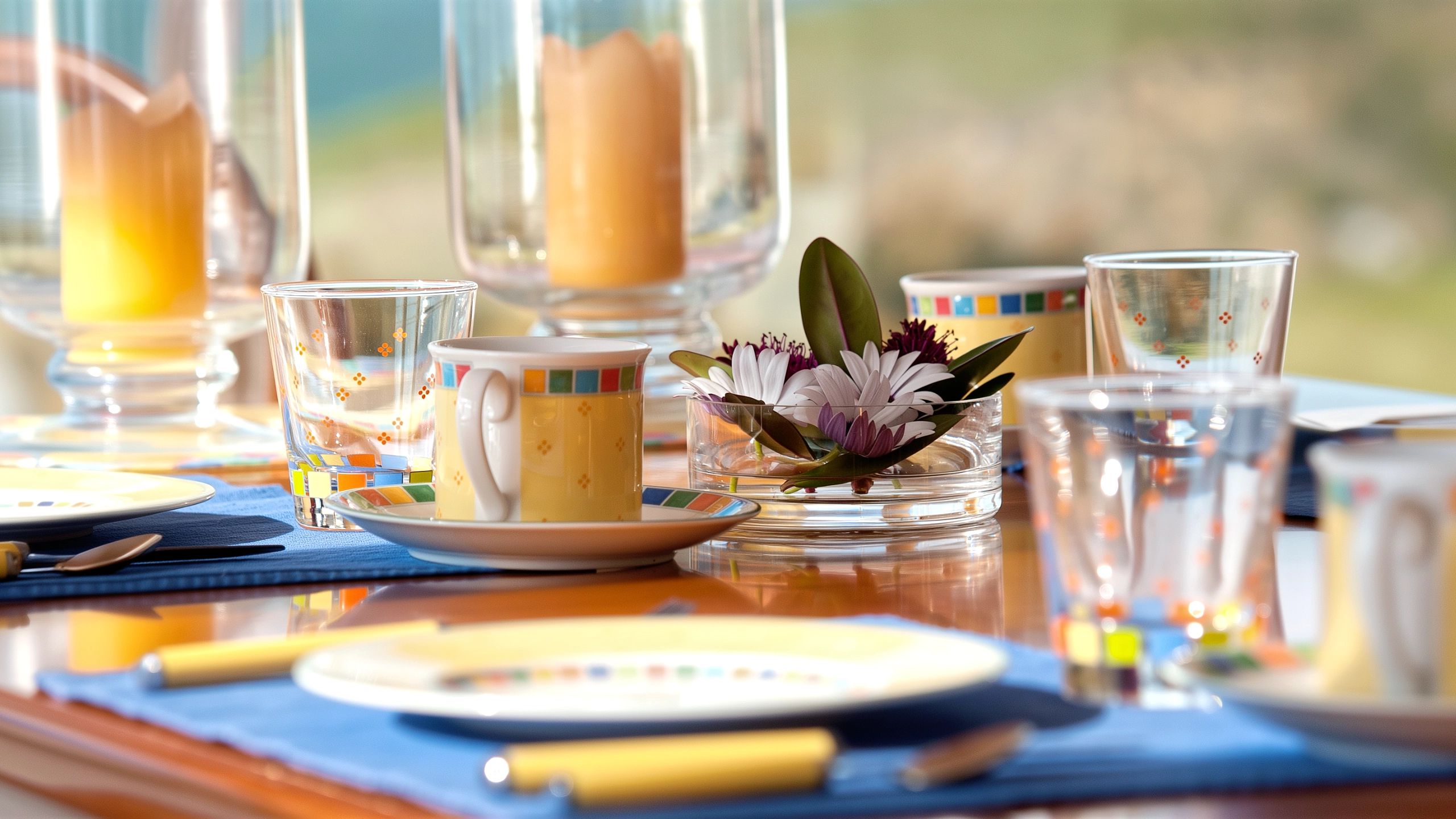 Close-up of colourful Villeroy & Boch Twist Alea Limone tableware set on dining table.